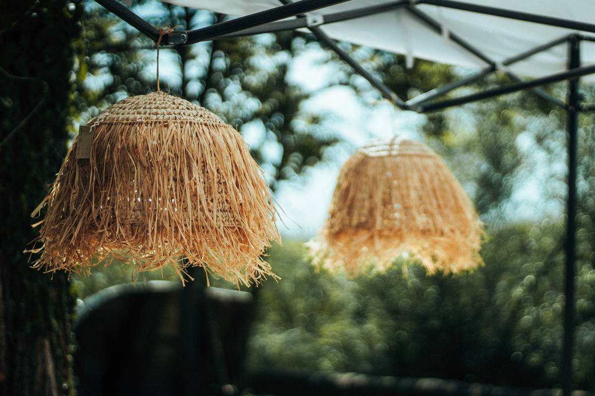 Photo of Maya's baby shower: organic cotton onesie garland with dried flowers and wooden signage